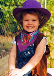 4 1/2 years old, sitting on a pony